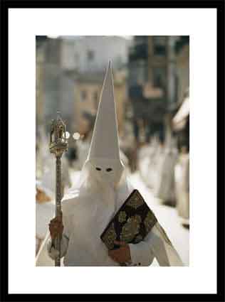 Masked penitent photographed during an Easter celebration